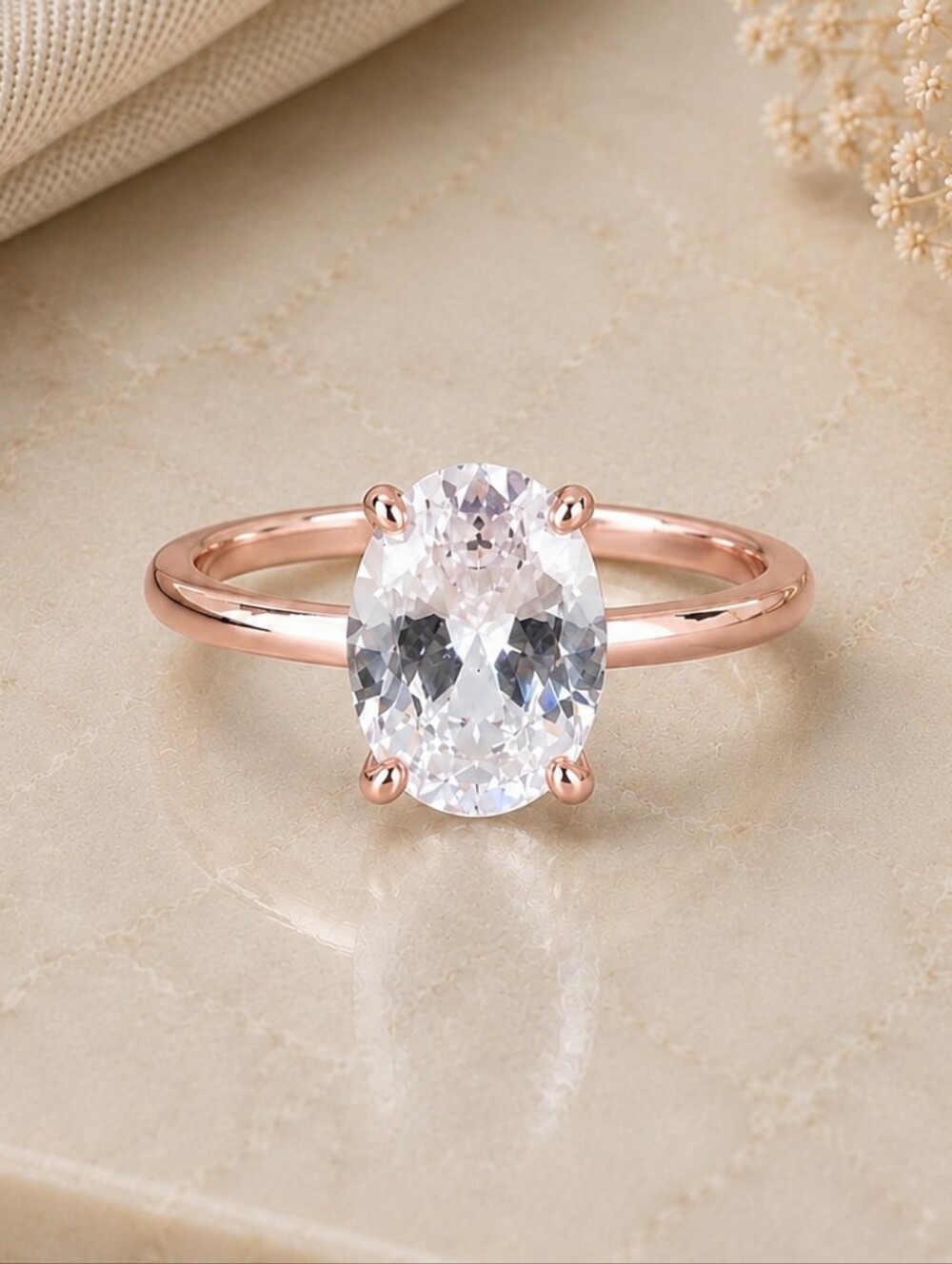 Rose Gold Oval Solitaire Ring with Clear Gem